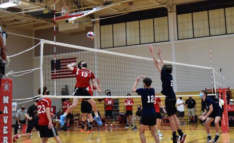 Boys’ volleyball captain Jackson Peakes coils his arm to spike the ball past the Houston Volleyball Academy blockers.