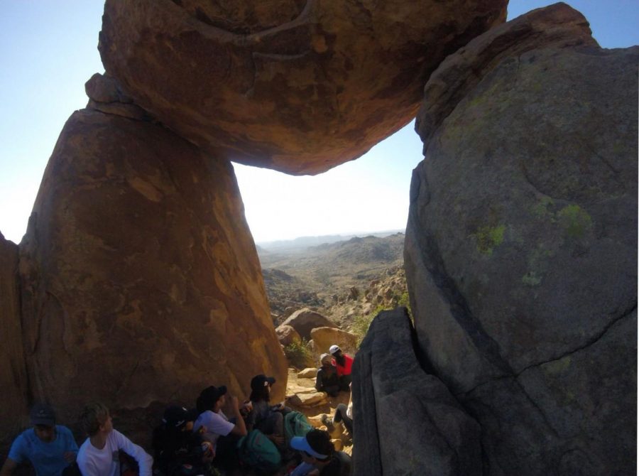 Eighth+graders+from+the+class+of+2022+rest+in+the+shade+during+a+long+hike.