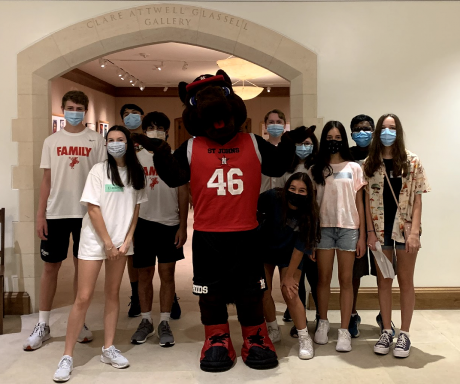 After belting their lungs out to the newly-learned V-I-C-T-O-R-Y cheer, the Curran advisory and their peer leaders Elizabeth Cox and Leo Morales talk to Chidsey, the school mascot. 