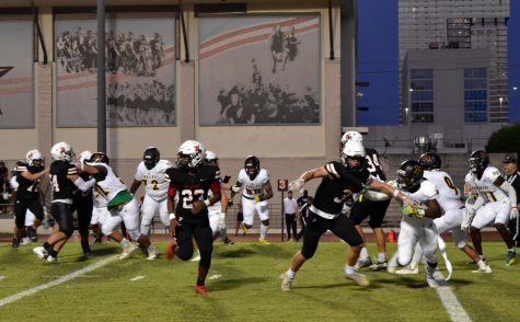 Cole Allen (number 23) runs a route as the Mavs attempt to convert on third down.