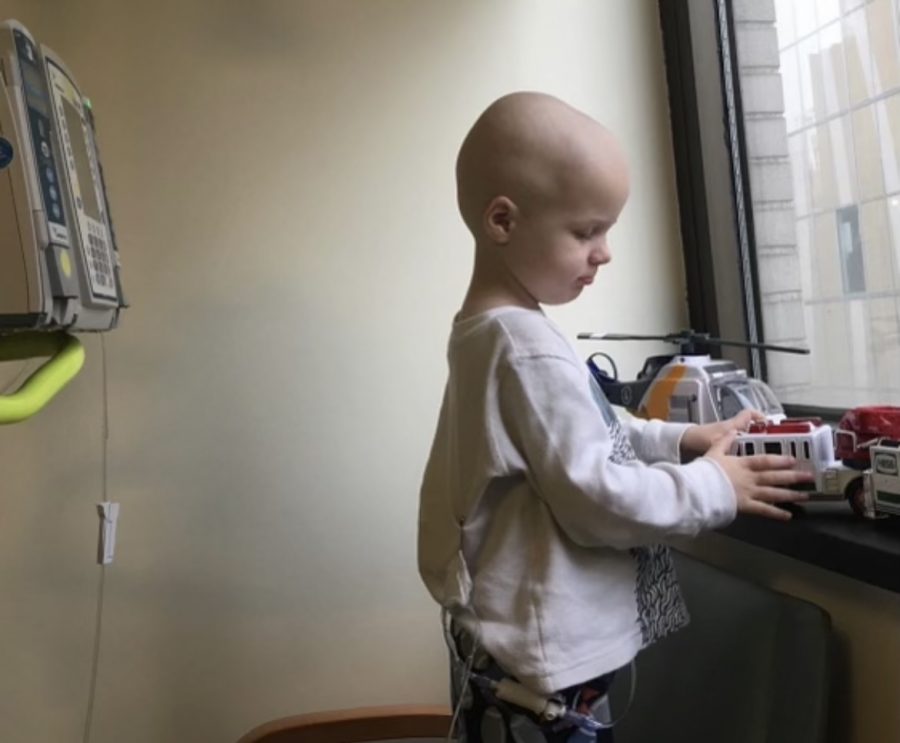 Lauren Bakers younger brother, Colin, plays with his toys while in the hospital. 