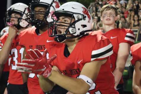 Senior Matthew Perez cheers on the team as they drive down the field. “The game was just electric,” Perez said. “I know for all the seniors, getting to beat Episcopal our last year here, is something we’ll remember for a long, long time.” 