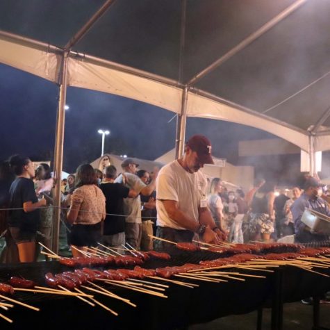 A man cooks authentic Greek food at the Greek festival. 
