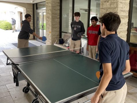 Sophomores spend their free carrier playing ping-pong with each other.