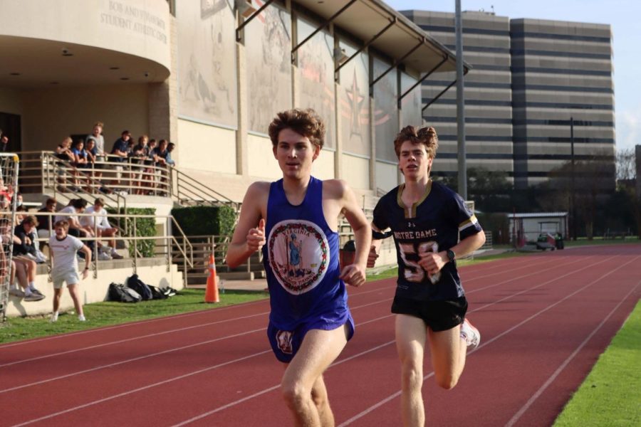 Junior William Thames grimaces, preparing to pass junior assignments editor Wilson Bailey at the 1200-meter mark.