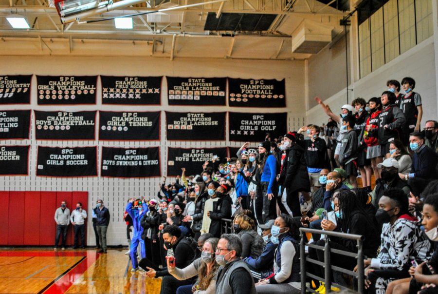 The student section returns and dons ski goggles and beanies in support of the Mavericks.