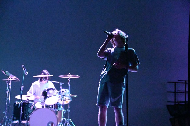 Colin McCullough, the lead singer of Triton, belts out the lyrics of “Cherub Rock” by The Smashing Pumpkins.