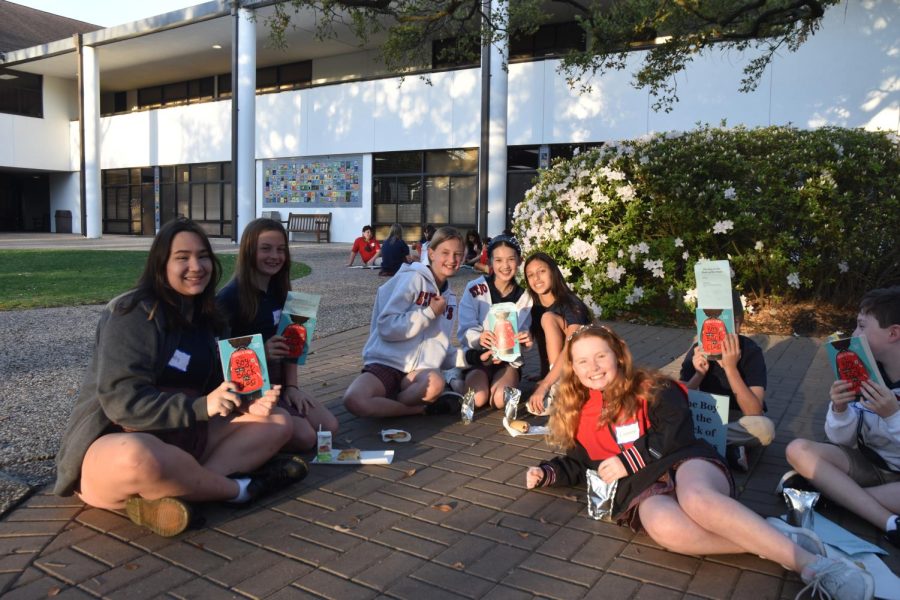 Upper School and Lower School students read together.