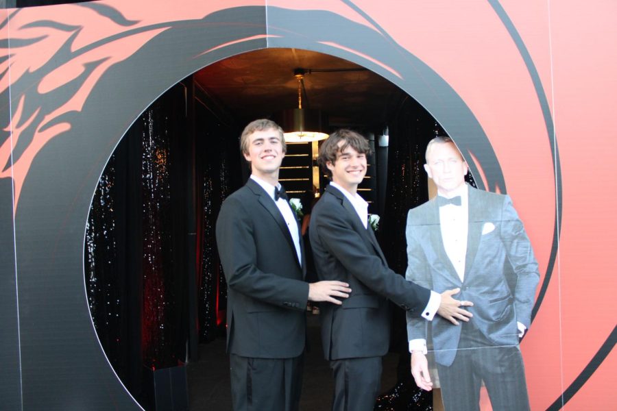Jack Bray, Matt Johnston, and James Bond assume the classic prom pose.