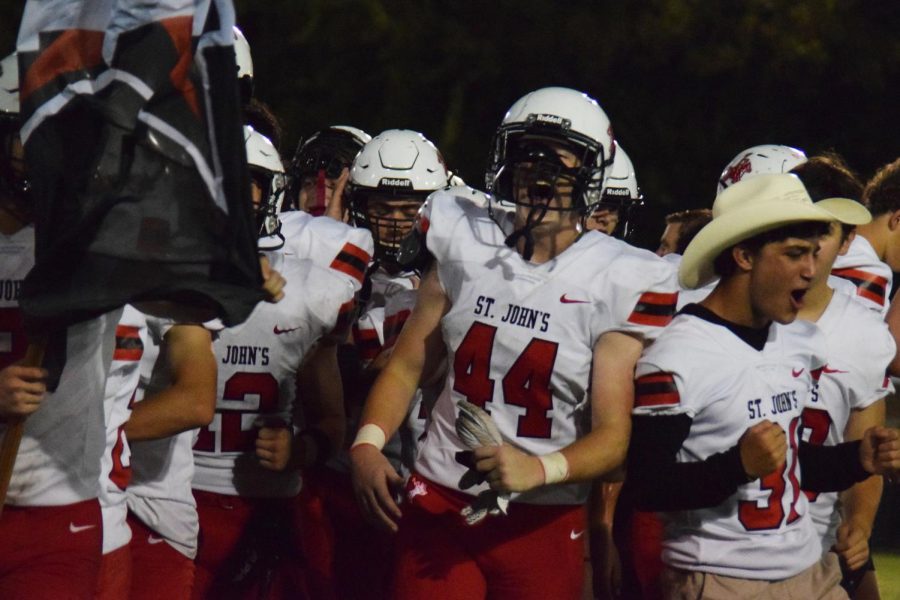 The Mavs celebrate another win at the second away game of the season and fill the air with shouts of emotion. As they come together in celebration, their passion echoes from the field to the crowd.