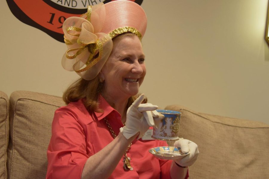 Bowen wears a hat that the Queen once wore and holds a tea set that honors the royal family. Her favorite tea cup has God Save the Queen inscribed on it. 