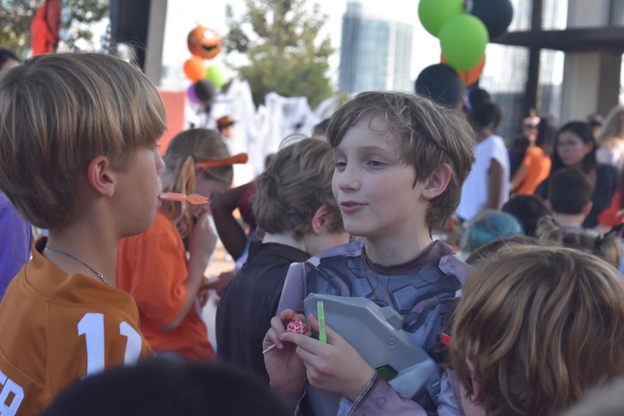 Students chat about Halloween festivities under Big Red.