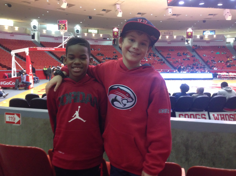 Eight-year-old+Wilson+Bailey+attends+a++Coogs+game+in+the+pre-Sampson+era.+The+stadium+is+noticeably+empty.
