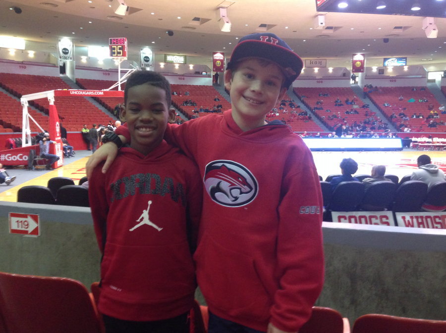 Eight-year-old Wilson Bailey attends a  Coogs game in the pre-Sampson era. The stadium is noticeably empty.