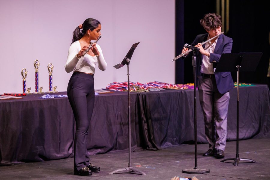 Junior Anya Yalamanchili and a fellow competitor perform a flute duet at the Symposium awards ceremony.
