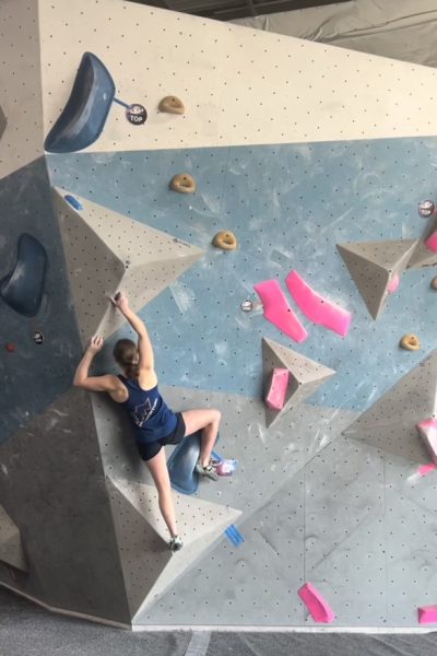 Freshman Olivia Titus tackles the rock wall, being one of few in her sport. 