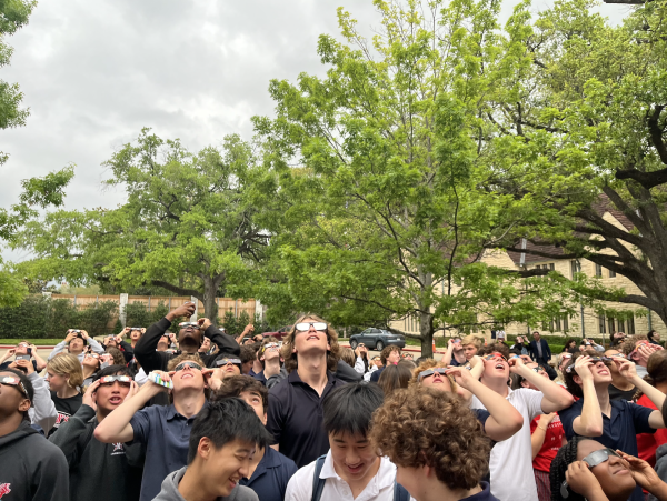 Upper School Students gather on the Plaza for a chance to witness a cosmic event that will not happen again until 2045. Courtesy Emily Reppart.