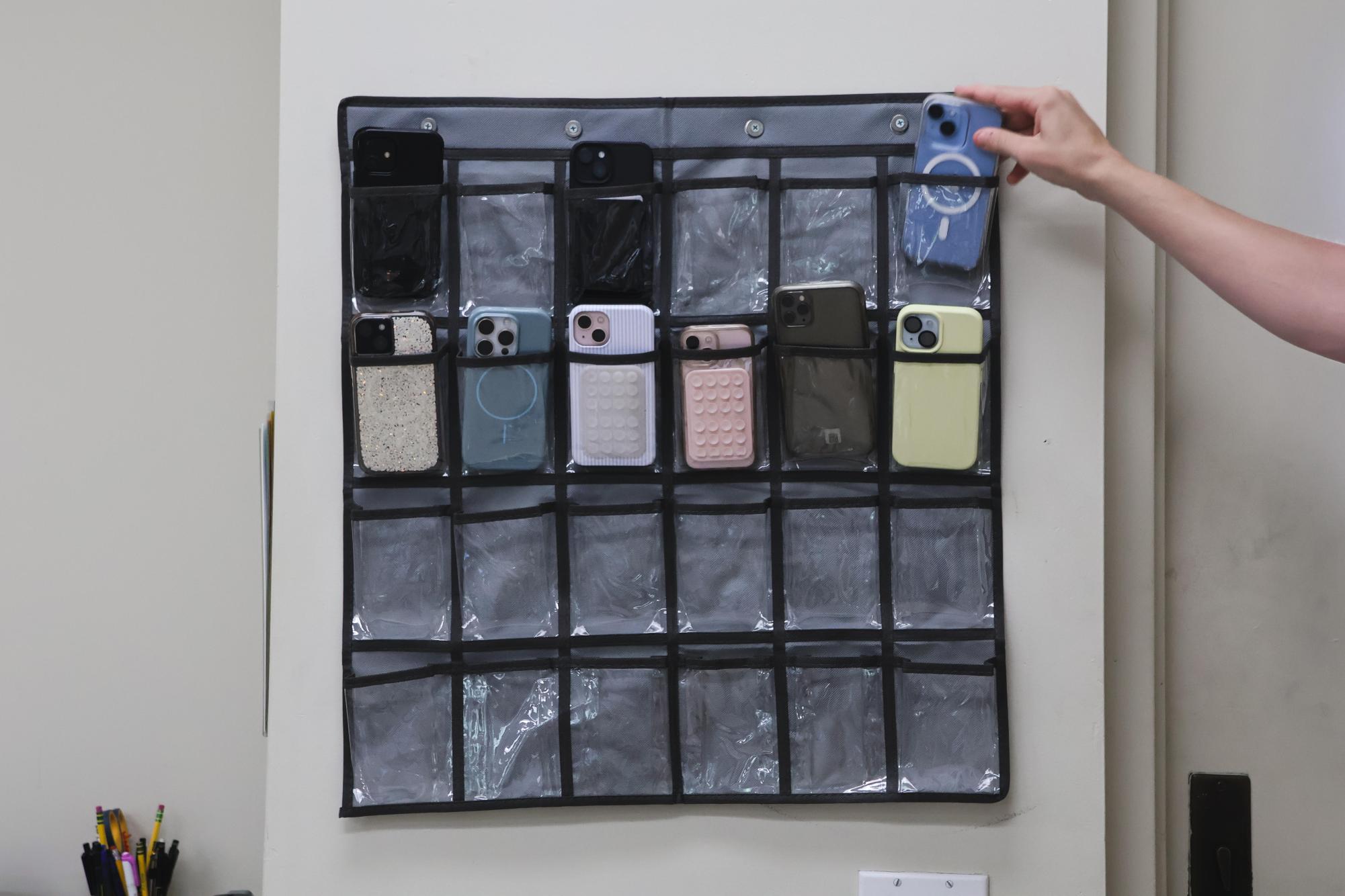 Teachers in the Upper School have begun requiring students to place their phones in caddies before each class. They hope to minimize distraction during lectures and work time. 