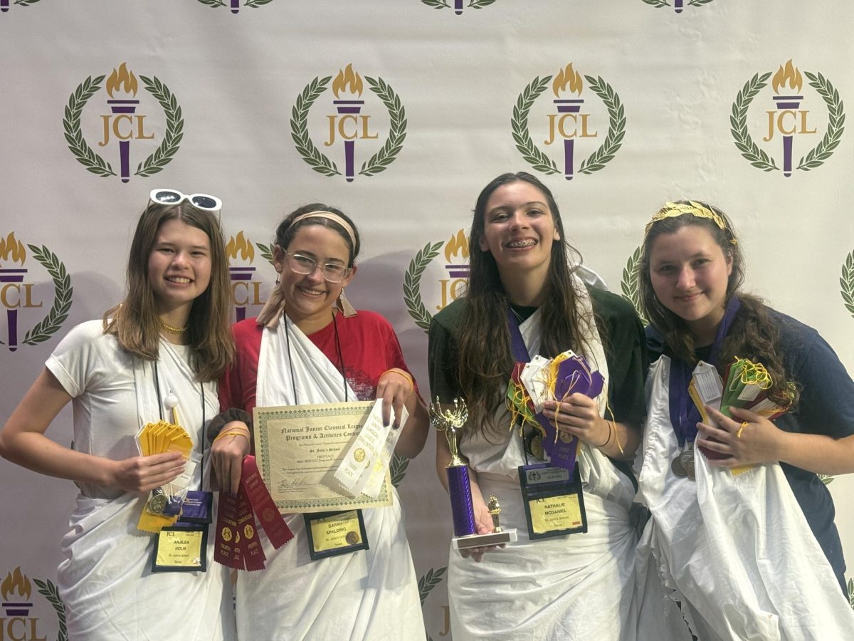 Juniors Anjilea Holm, Sarah Spalding, Nathalie McDaniel and Aurelia Shaitelman (pictured left to right) receive awards at a JCL convention. 

