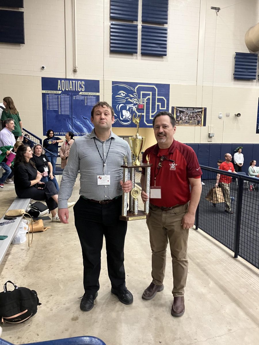 JCL sponsors Zachary Flowerman and David Frauenfelder hold the second place Sweepstakes award for the Middle School. 