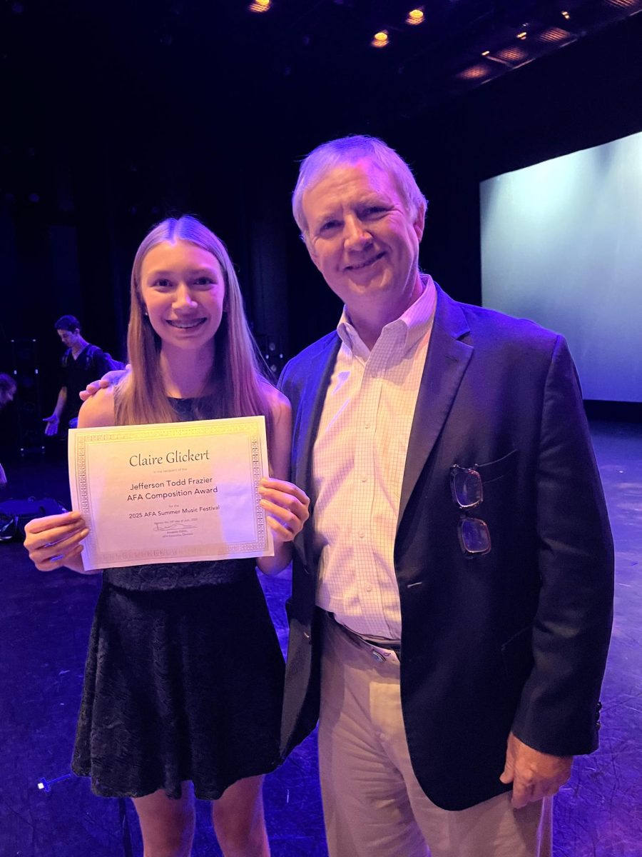 Claire Glickert holds the Jefferson Todd Frazier American Festival of the Arts Composition award. She is standing next to Jefferson Todd Frazier, the founder of AFA. Courtesy of Claire Glickert.